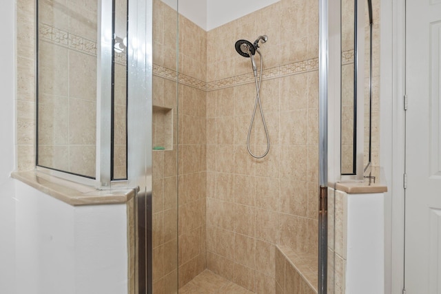 bathroom featuring tiled shower