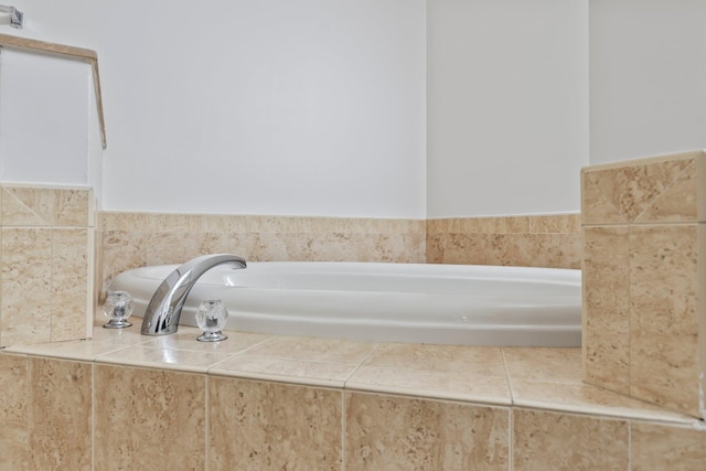 bathroom featuring tiled tub