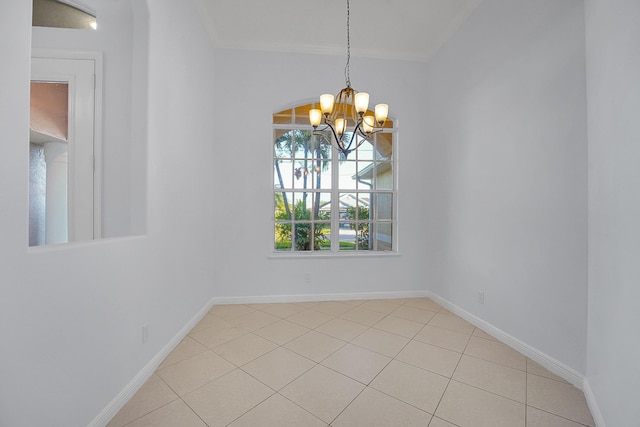 tiled empty room with a chandelier