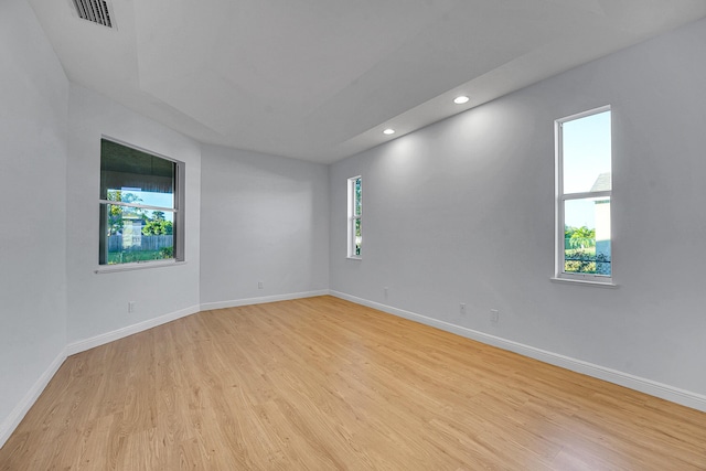 spare room featuring light hardwood / wood-style flooring