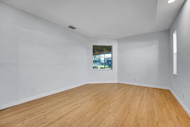 spare room featuring light hardwood / wood-style flooring