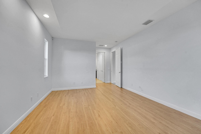 unfurnished room with light hardwood / wood-style floors