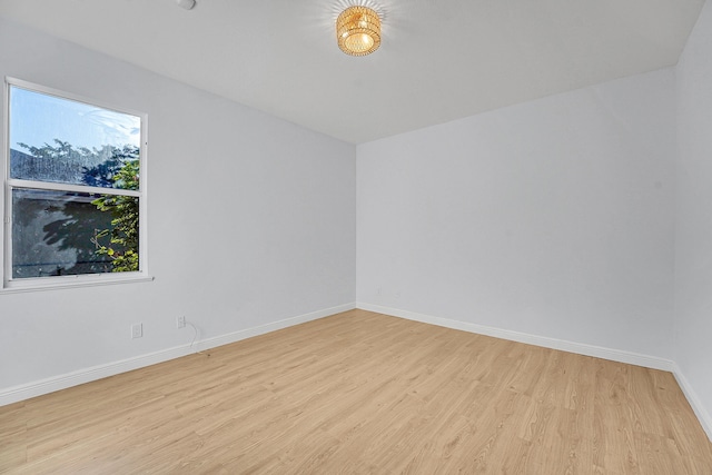 spare room with light hardwood / wood-style floors