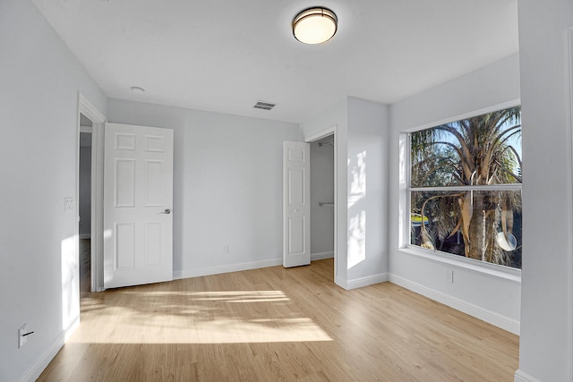 unfurnished bedroom with light wood-type flooring