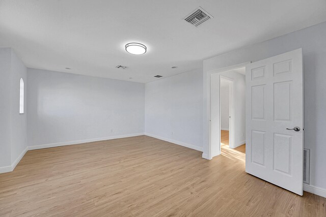 unfurnished room featuring light wood-type flooring