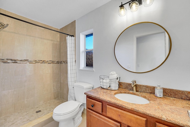 bathroom with vanity, a shower with shower curtain, and toilet