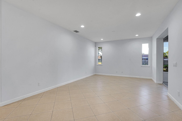 empty room featuring light tile patterned floors