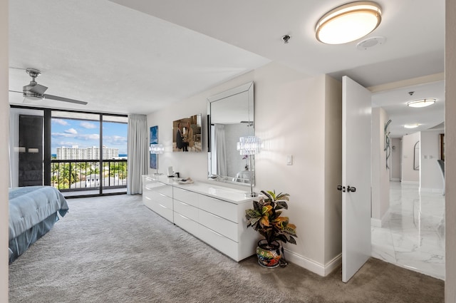 bedroom with floor to ceiling windows, carpet, baseboards, and access to outside