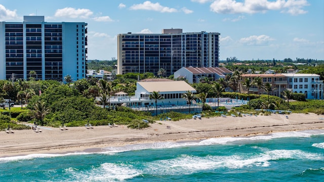 birds eye view of property featuring a view of the beach and a water view