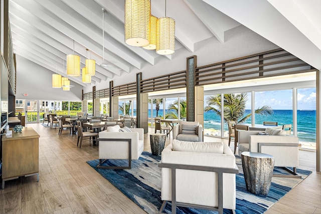 view of patio with outdoor dining area, a water view, and an outdoor hangout area