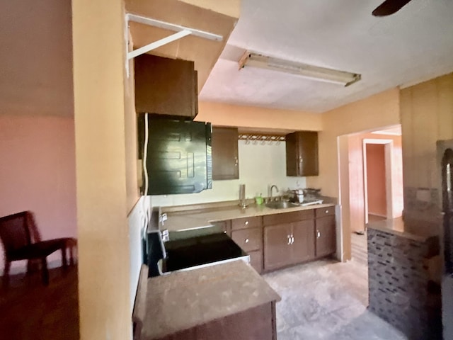 kitchen featuring stove and sink