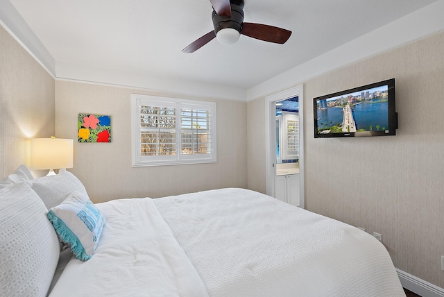 bedroom featuring ceiling fan and ensuite bathroom