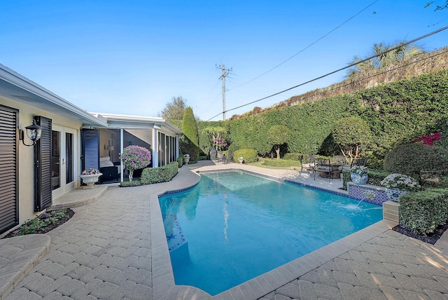 view of pool featuring a patio area and pool water feature