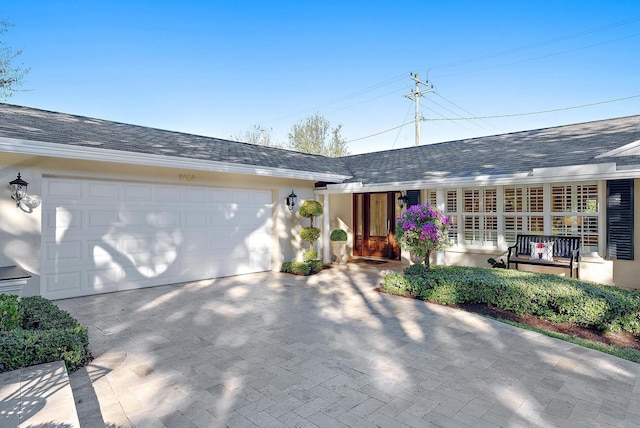 ranch-style home with a garage