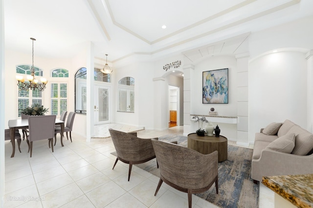 living room featuring light tile patterned flooring and a chandelier