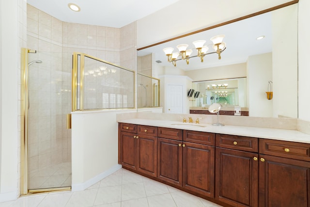 bathroom featuring tile patterned floors, vanity, and walk in shower