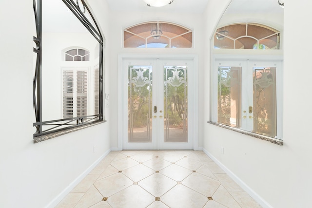 doorway featuring french doors and vaulted ceiling