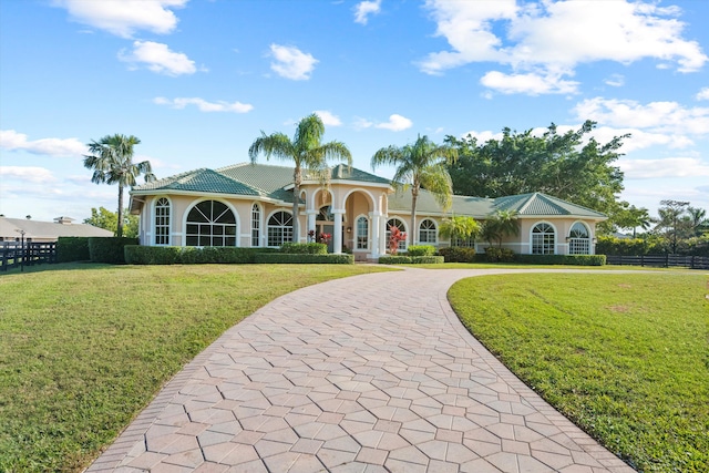 view of front of home with a front lawn