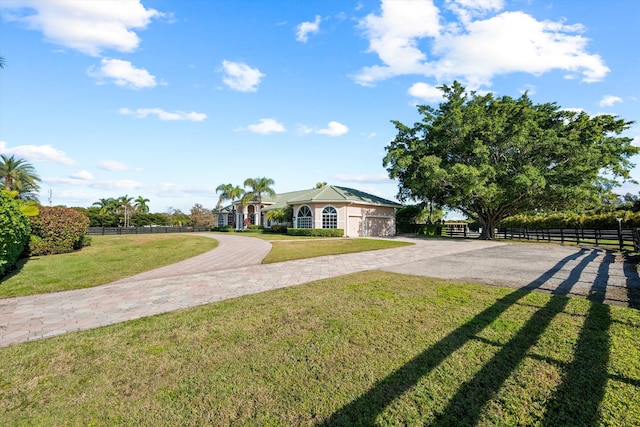 single story home featuring a front lawn