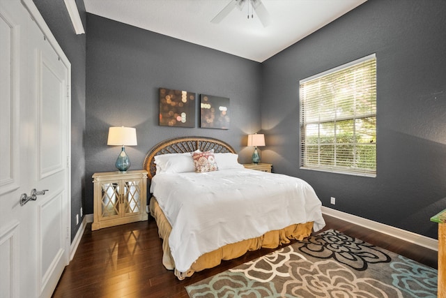 bedroom with a closet, ceiling fan, and dark hardwood / wood-style floors