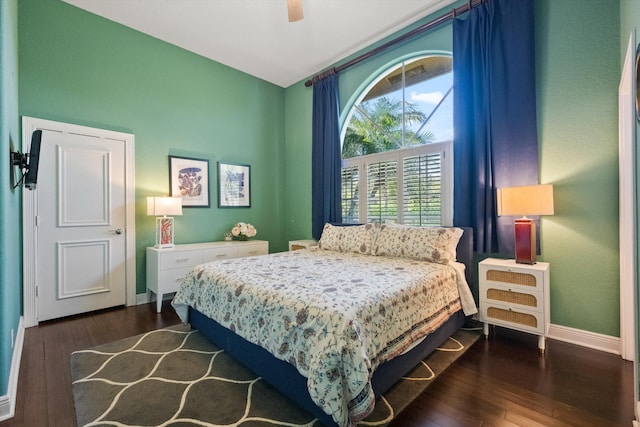 bedroom with ceiling fan and dark hardwood / wood-style flooring