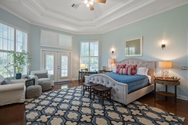 bedroom with multiple windows, wood-type flooring, access to outside, and ceiling fan