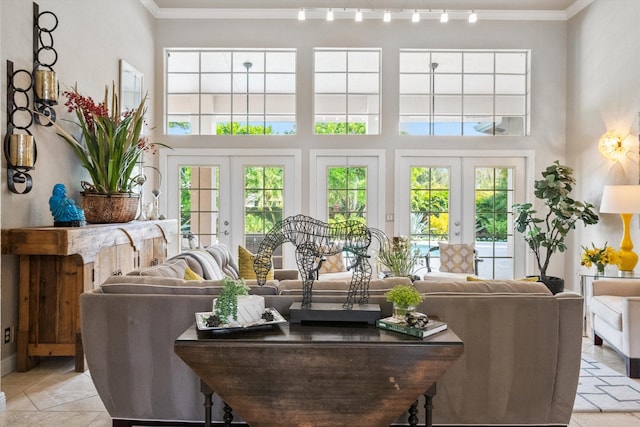 sunroom / solarium featuring plenty of natural light and french doors