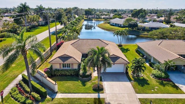 birds eye view of property featuring a water view