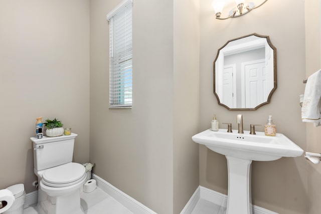 bathroom featuring toilet and sink