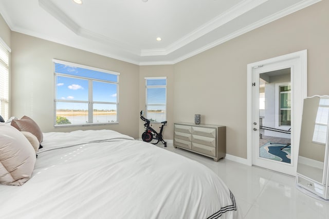 bedroom featuring light tile patterned flooring, crown molding, and a tray ceiling