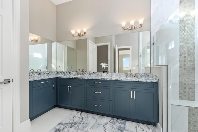 bathroom featuring vanity and a shower with shower door