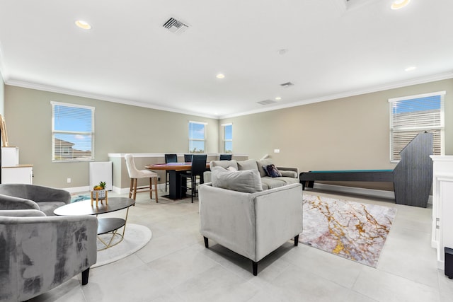 living room featuring crown molding