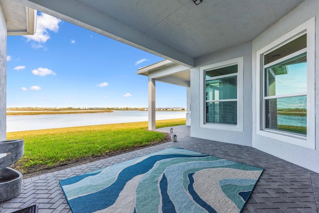 view of patio / terrace featuring a water view