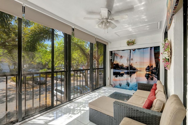 sunroom featuring ceiling fan