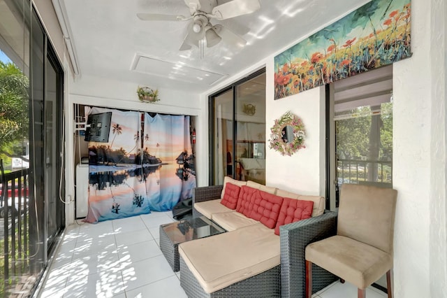 sunroom featuring a ceiling fan