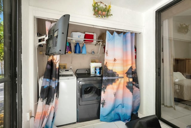 laundry area with washing machine and dryer