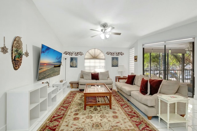 living room featuring light tile patterned floors, lofted ceiling, and a ceiling fan