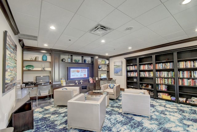 sitting room featuring built in shelves, visible vents, carpet floors, and ornamental molding