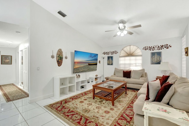 living area with a ceiling fan, visible vents, baseboards, lofted ceiling, and tile patterned floors