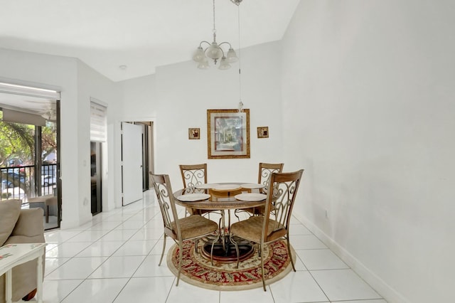 dining room with light tile patterned floors, baseboards, and an inviting chandelier