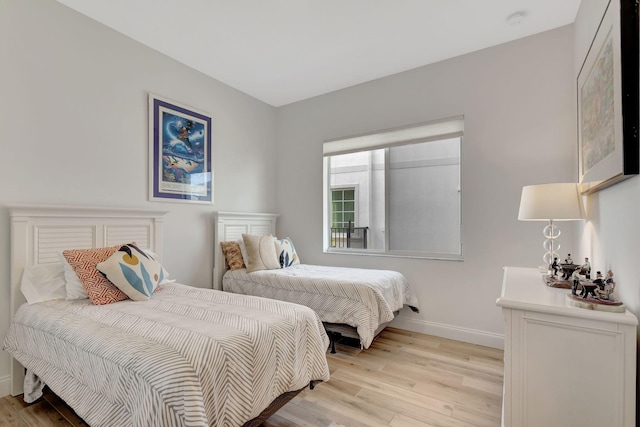 bedroom with light hardwood / wood-style floors