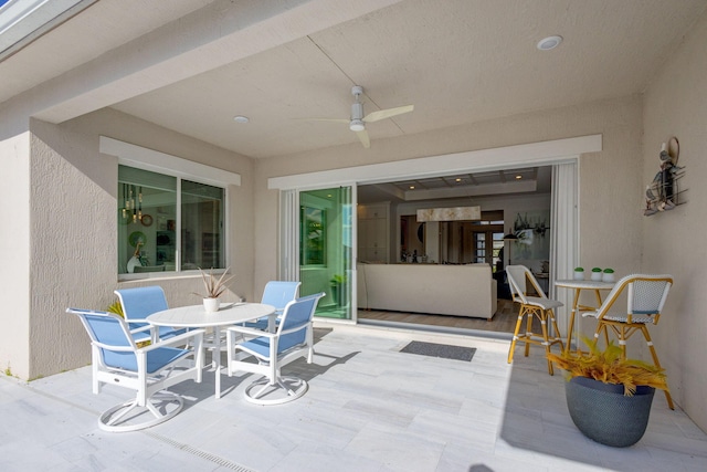 view of patio / terrace featuring ceiling fan