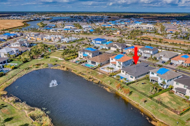 drone / aerial view with a water view