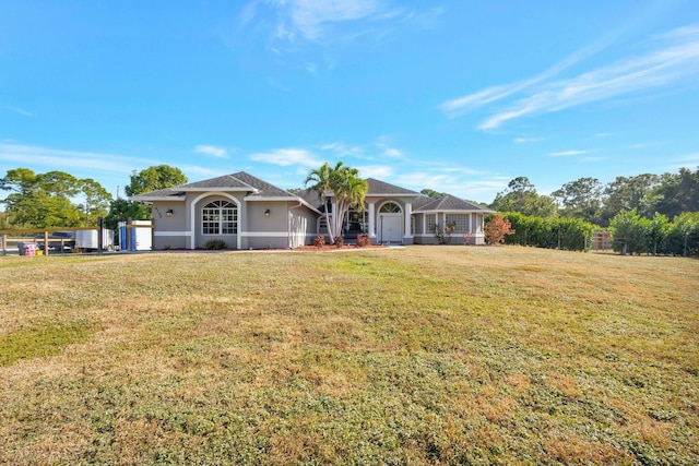 ranch-style house featuring a front lawn