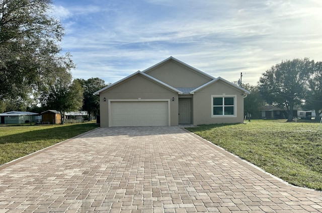 ranch-style home with a front yard and a garage