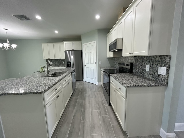 kitchen featuring white cabinetry, sink, an inviting chandelier, decorative light fixtures, and appliances with stainless steel finishes