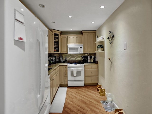 kitchen with backsplash, light brown cabinets, white appliances, and light wood-type flooring