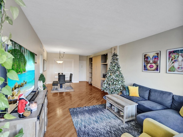 living room featuring hardwood / wood-style floors and a textured ceiling