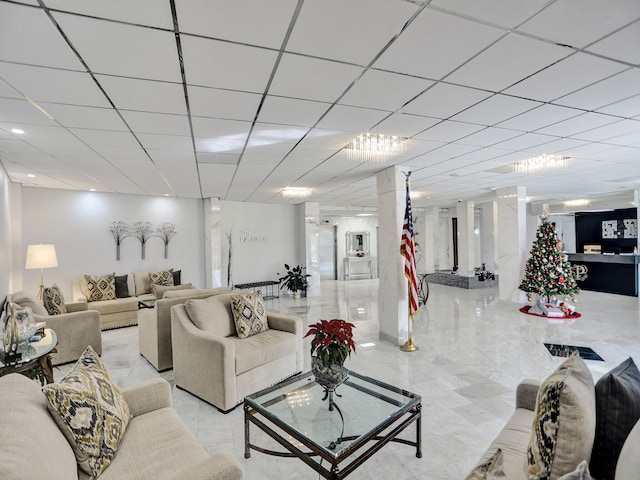 living room featuring a paneled ceiling