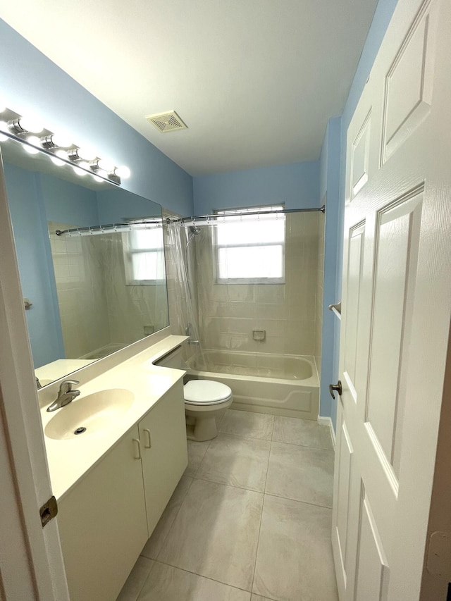 full bathroom featuring vanity, shower / tub combo, tile patterned floors, and toilet